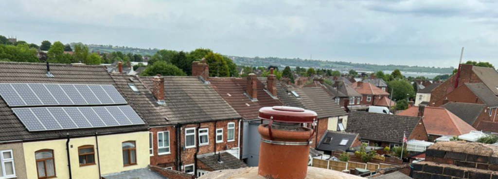 This is a photo taken from a roof which is being repaired by LJ Roofing Grove, it shows a street of houses, and their roofs