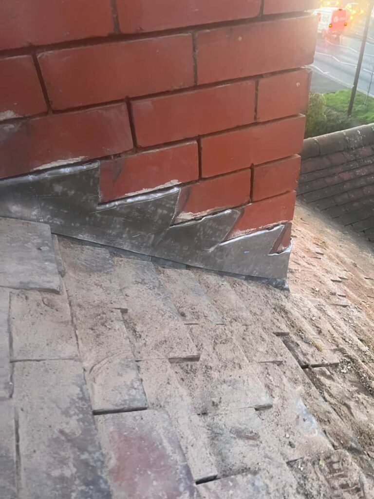 This is a photo of new leadwork being installed around an old chimney. Works carried out by LJ Roofing Grove